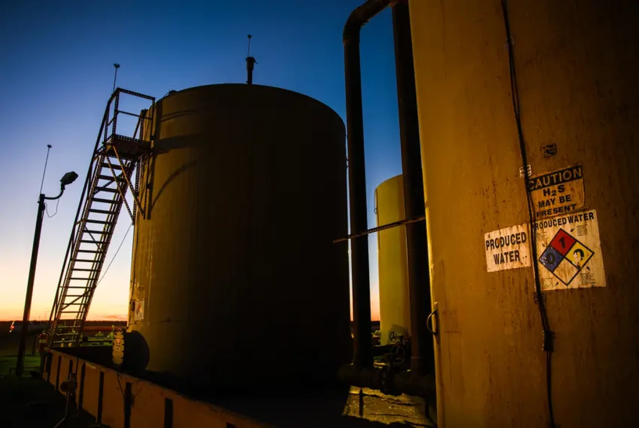 A produced water tank sits at an injection well site outside of Odessa on Jan. 31, 2022.